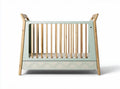 Wooden crib with geometric design in mint green and natural finish 120 x 70 x 90cm